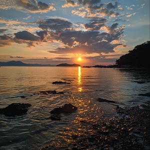 shiny aiguo island sunrise tour from shiowane's jiaowan beach, in the style of 32k uhd, snapshot aesthetic, cottagepunk, hudson river school, calming, high-angle, tondo