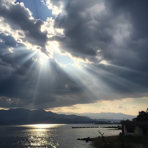 In the evening, there is some light shining through clouds in the sky above Japan's slowly rising sea level near Oovereovei port on Shikoku Island, which illuminates part of Lake connected to ocean and mountains. The photo was taken with an iPhone camera using flash. It shows dramatic clouds with sunbeams piercing them. In front you can see small buildings at right side of frame. On background far away are visible islands of Nikon D850 DSLR style raw ar 7:8 v 6.0 s 50 style raw